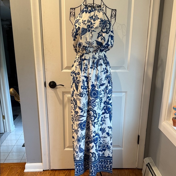 Sleeveless halter style blue, and white floral jumpsuit - Picture 3 of 6